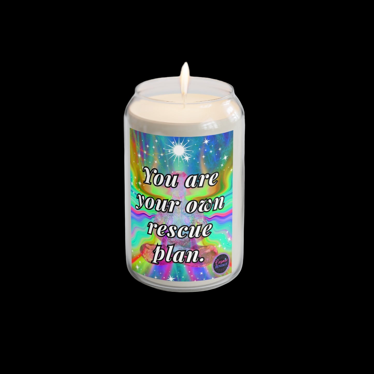 Candle with motivational label on a white surface with a plant and watch in the background