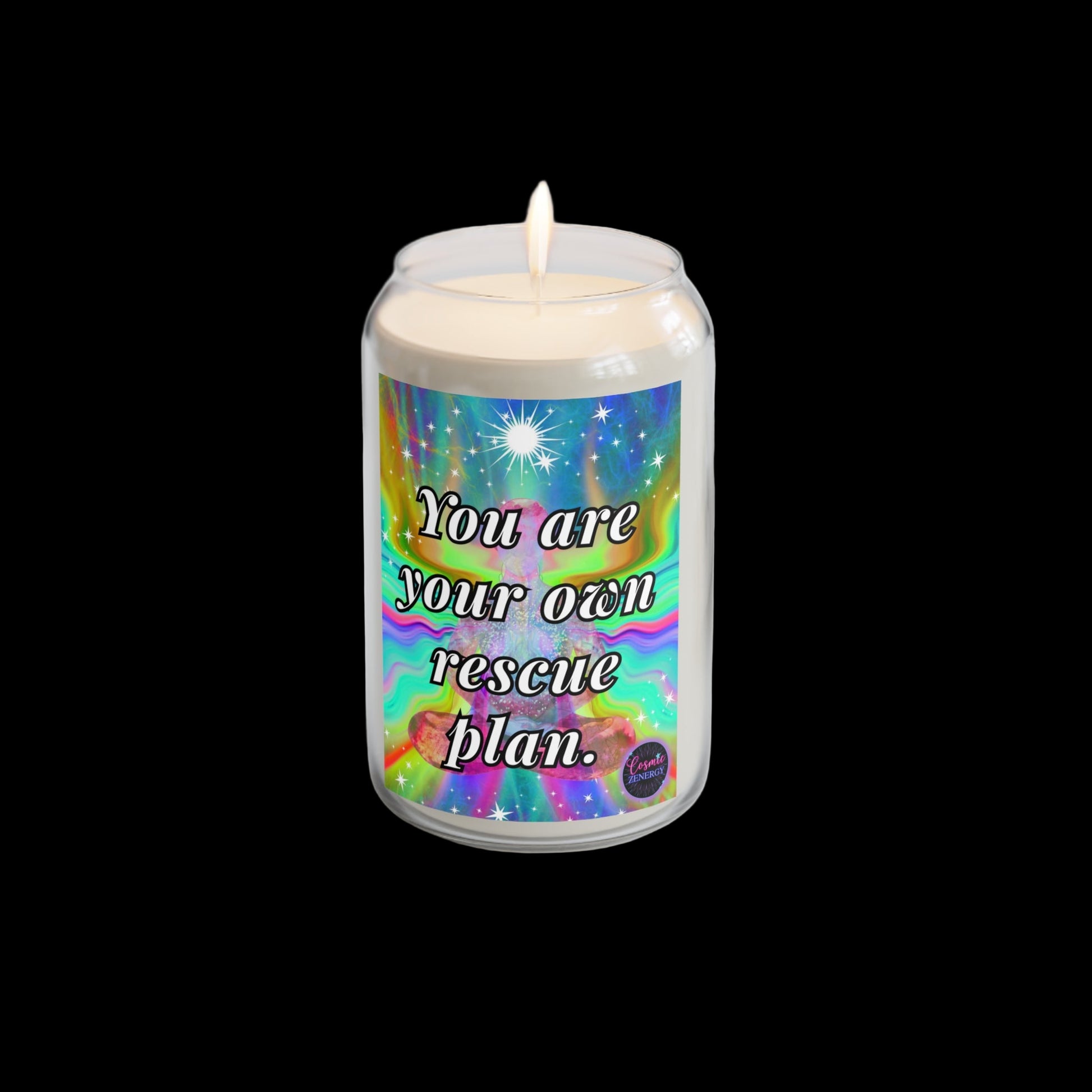 Candle with motivational label on a white surface with a plant and watch in the background